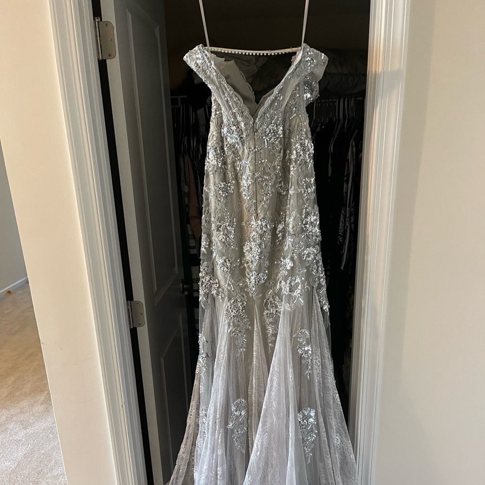 Formal gown size 2. Straps were removed however I have both straps. Silver.